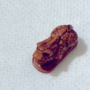 Very detailed carved bead of an Asian mystical creature I think it’s a pichu